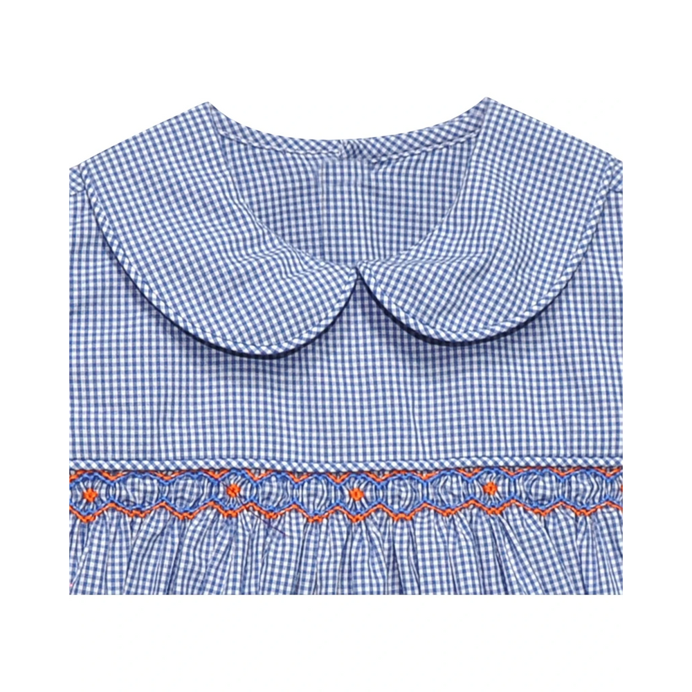That Store girls bubble in navy and white gingham with a peter pan collar and orange and blue geometric smocking.