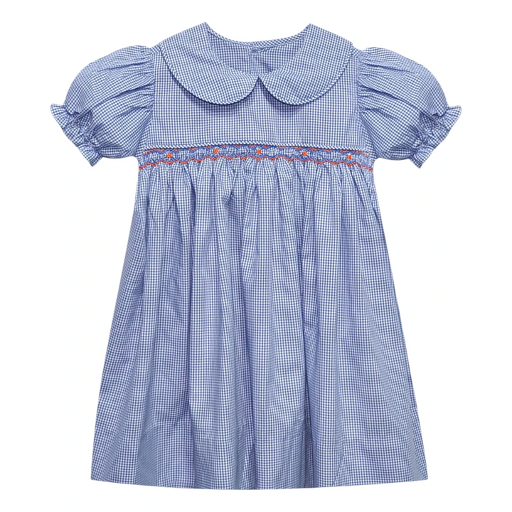 That Store navy and white gingham smocked dress with orange embroidery, puff sleeves, and a Peter Pan collar.
