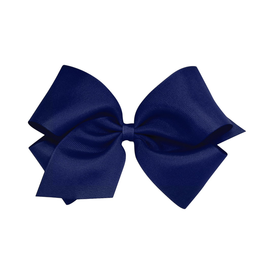 That Store navy blue grosgrain king hair bow with a no-slip alligator clip for toddlers and girls