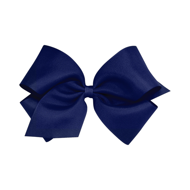 That Store navy blue grosgrain king hair bow with a no-slip alligator clip for toddlers and girls