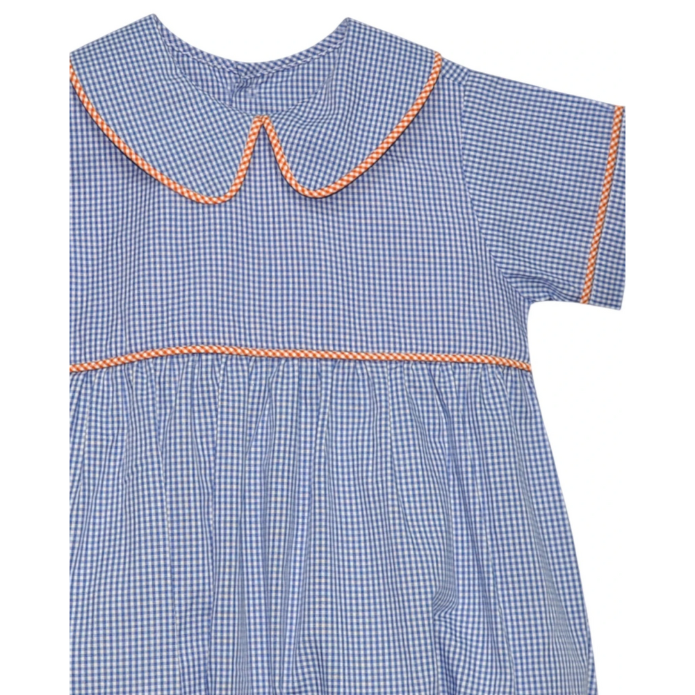 That Store boys bubble romper in navy and orange gingham with a Peter Pan collar and orange piping trim.