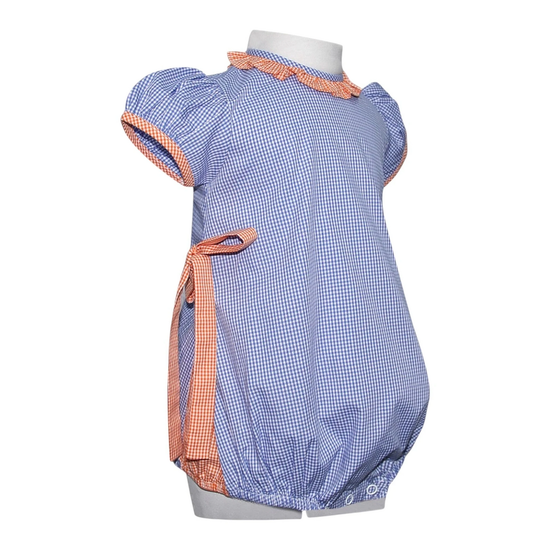 That Store navy and orange gingham bubble romper for girls with ruffled trim and side tie detail