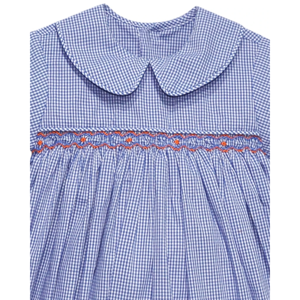 That Store navy and orange gingham smocked bubble with a Peter Pan collar and geometric embroidery detail.