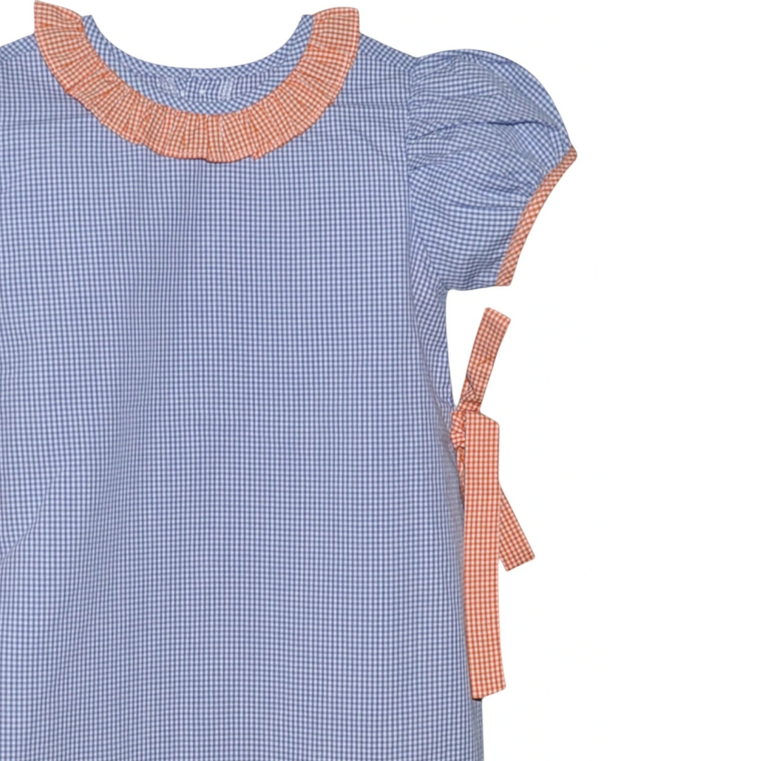 That Store navy and orange gingham tie dress with ruffled collar and puff sleeves in a soft cotton-polyester blend.