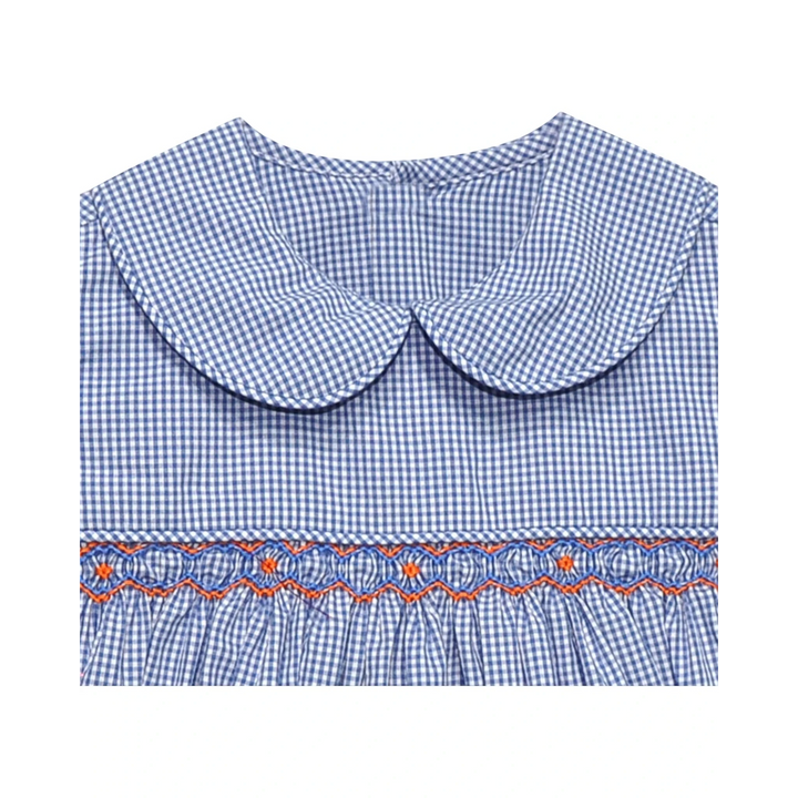 That Store navy and orange gingham smocked dress with a peter pan collar and geometric embroidery detail