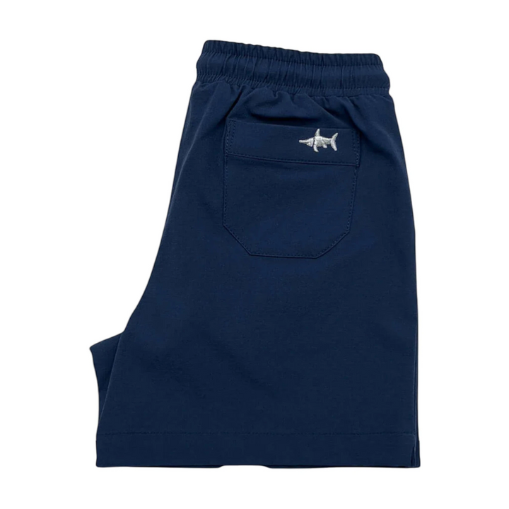 That Store navy performance shorts for boys featuring an elastic drawstring waist and embroidered marlin logo pocket.