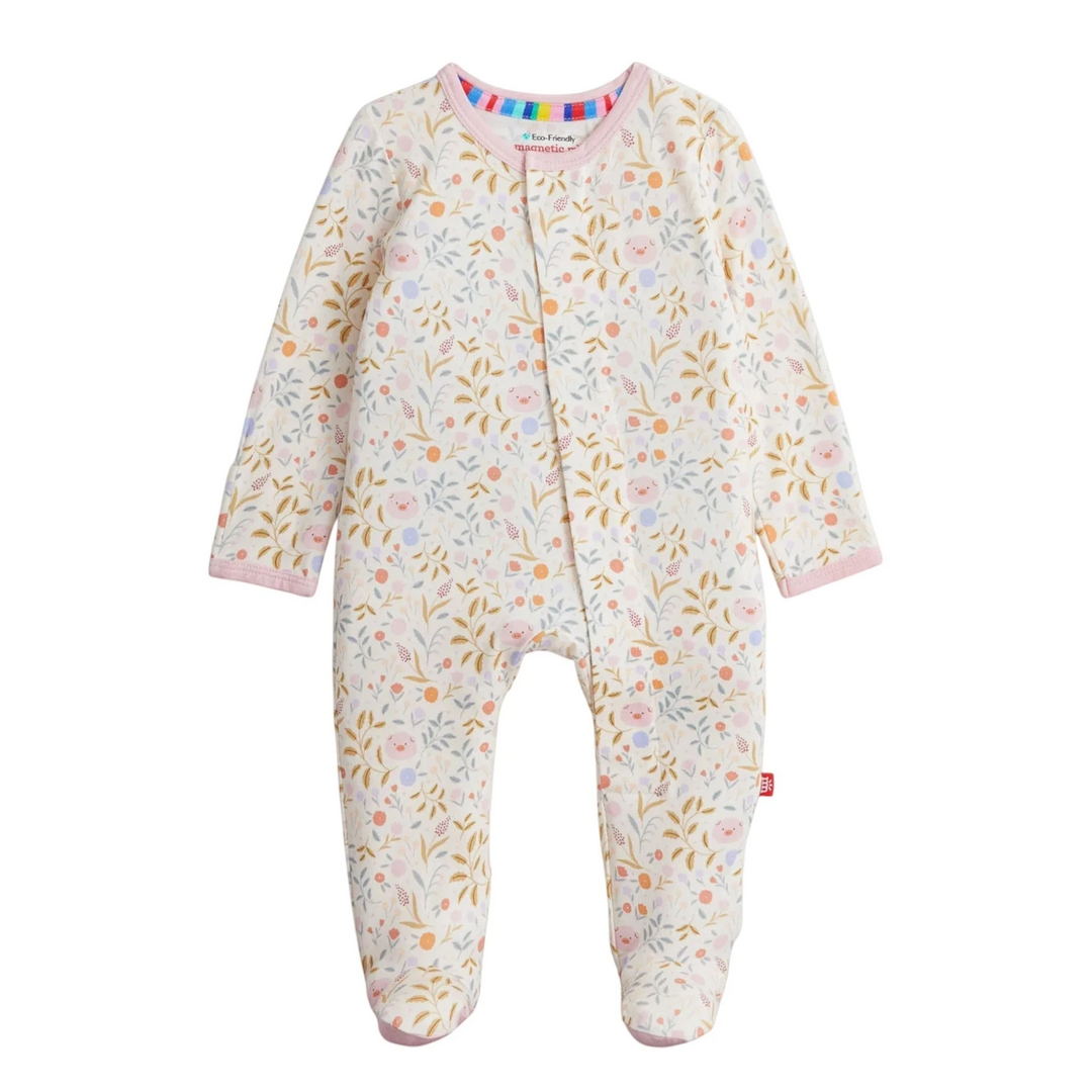 That Store Oinklet modal baby footie with magnetic closures, featuring a floral and pig print on a cream background.