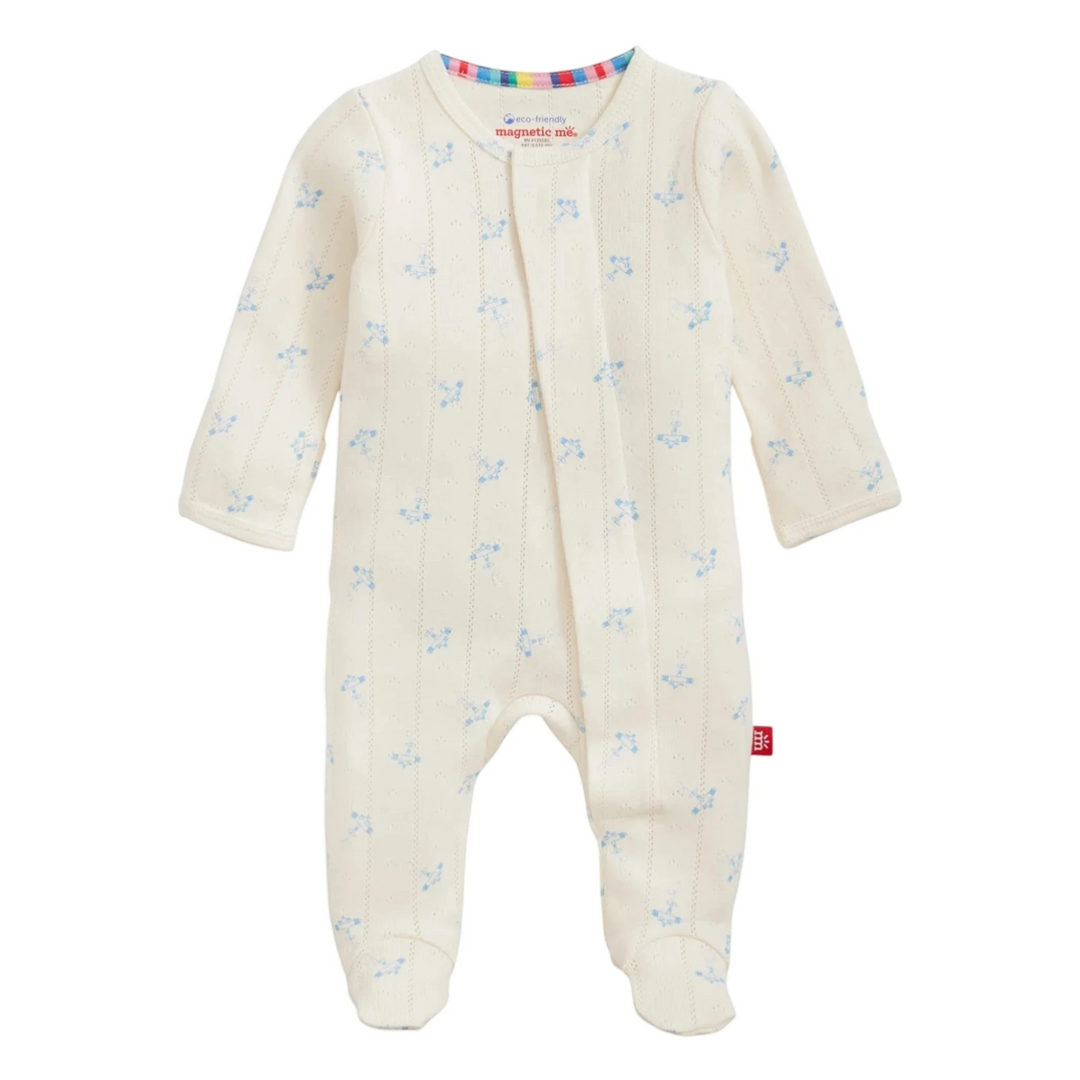 That Store organic cotton pointelle baby footie in cream with a blue airplane print and magnetic closures