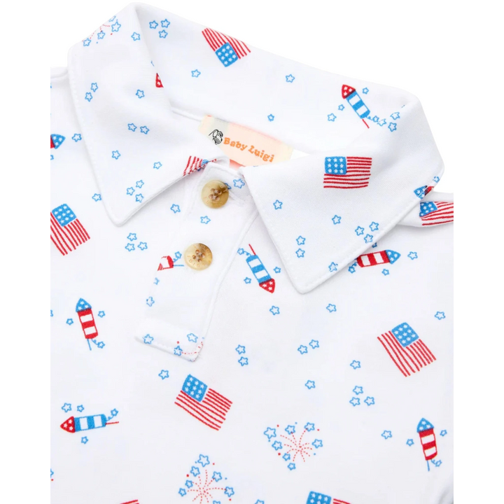 That Store boys polo shirt in white cotton with a red, white, and blue American flag and fireworks patriotic print.