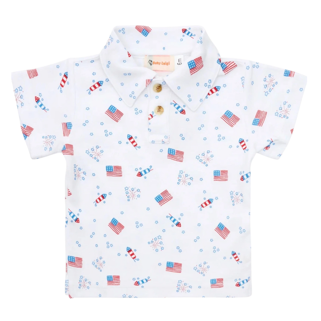 That Store boys polo shirt in white cotton with a patriotic red, white, and blue flag and fireworks print.