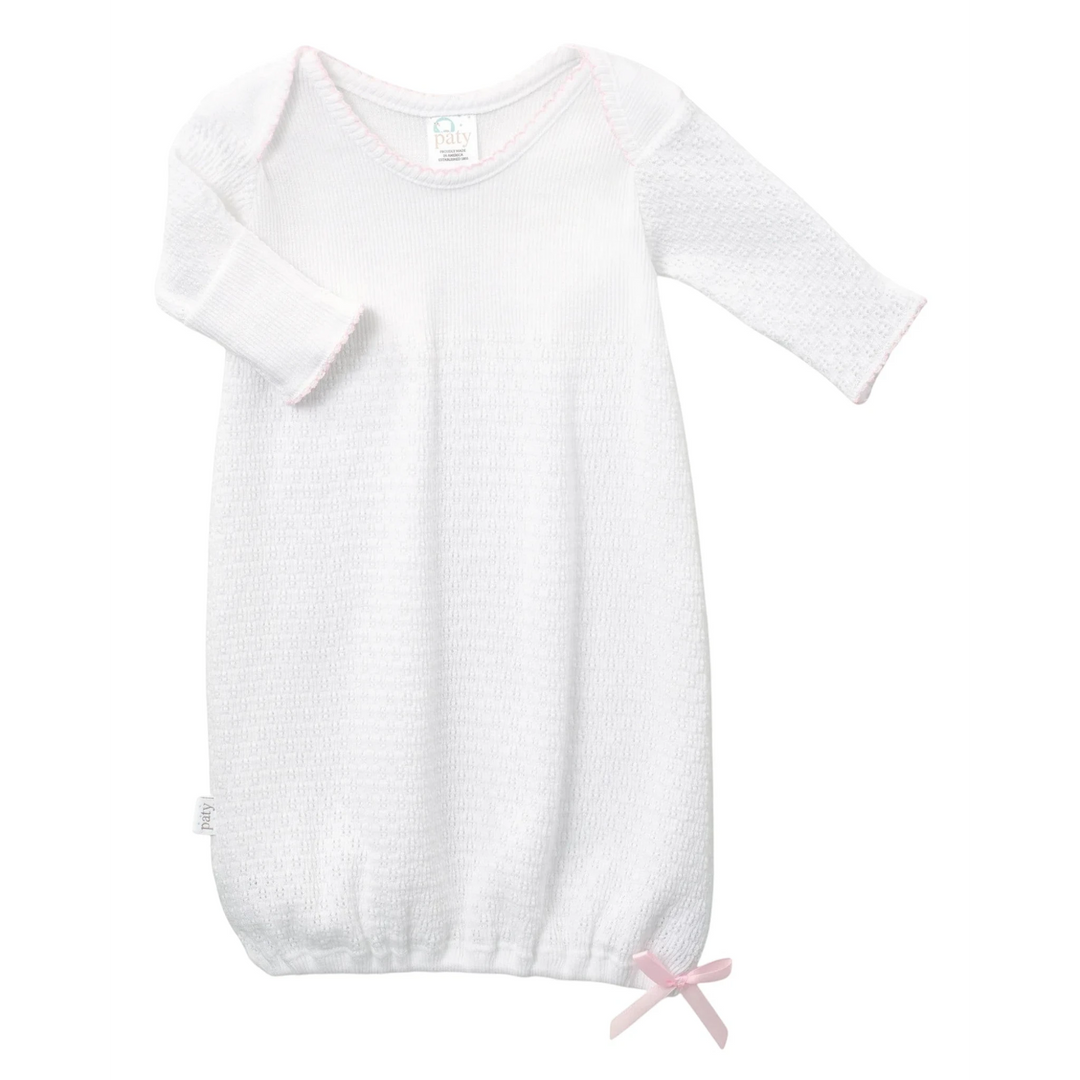 That Store Paty Knit baby gown in white with pink trim, overlap shoulders, and fold-over cuffs for newborns.