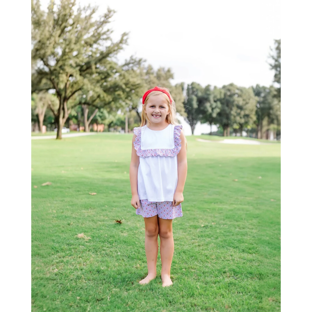 That Store Penelope girls' short set in bunting floral print with a ruffled square neck top and white cotton shorts.