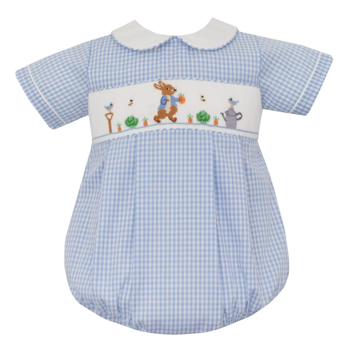 That Store smocked Peter Rabbit bubble romper in blue gingham with a white Peter Pan collar and garden embroidery.