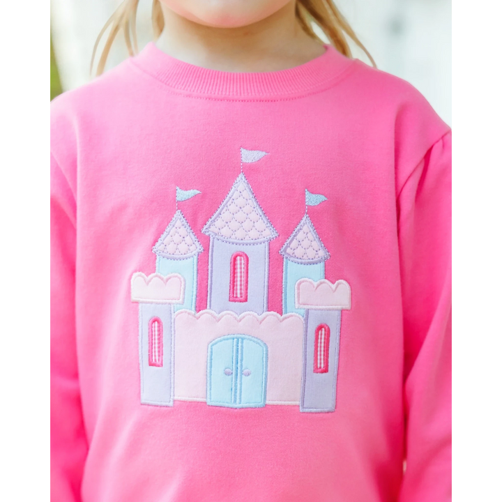 That Store pink French terry pullover for girls featuring a whimsical embroidered castle design on the front