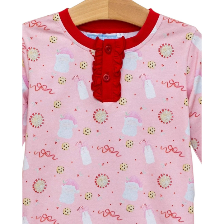 That Store pink cotton lounge set with festive Santa, milk, and cookie print and red ruffle button placket