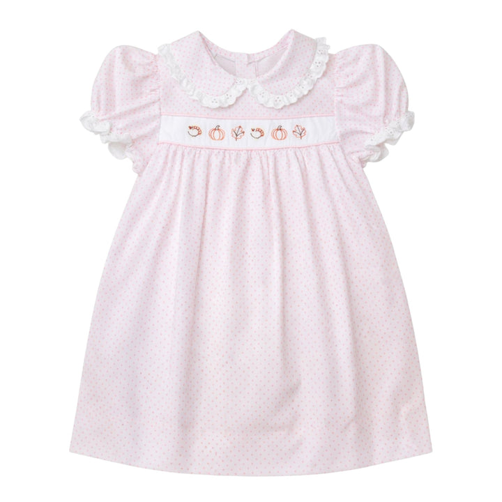 That Store pink dot Alice dress with fall leaf and pumpkin embroidery, white eyelet collar, and puff sleeves.