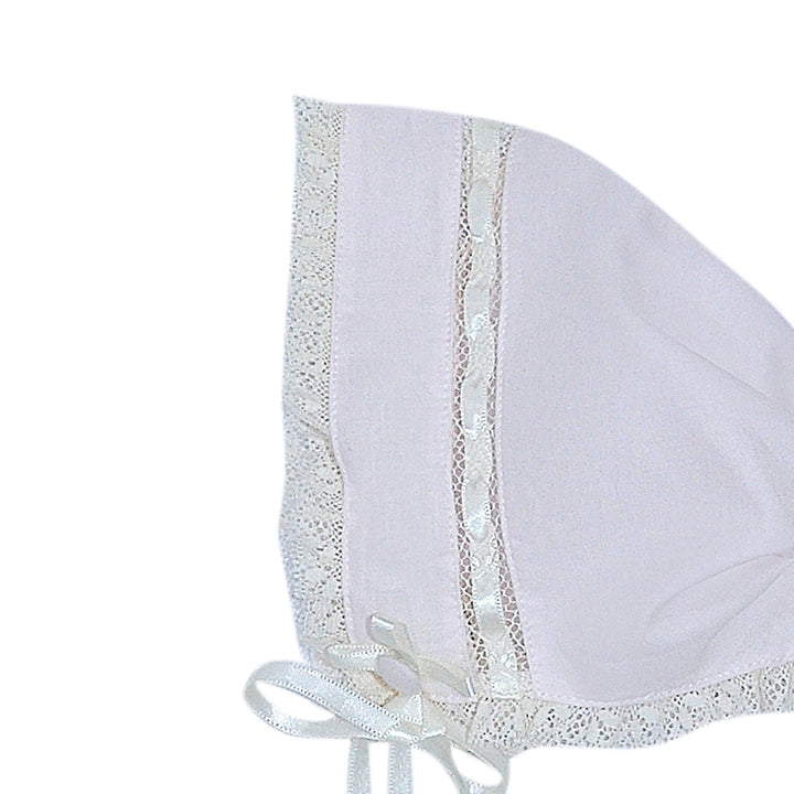 That Store pink baby bonnet with delicate ecru lace trim and a small ribbon bow detail