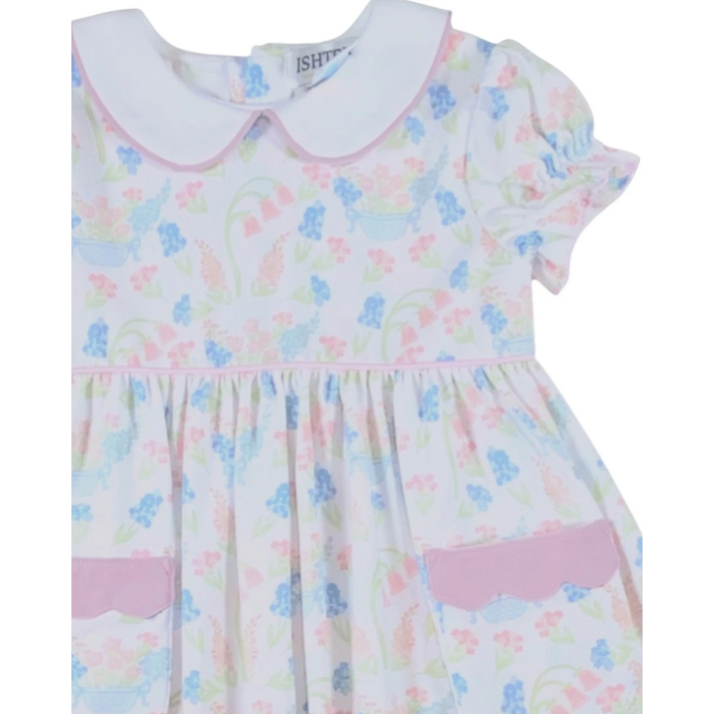 That Store primrose pink floral dress with white peter pan collar, puff sleeves, and scalloped pocket detail.
