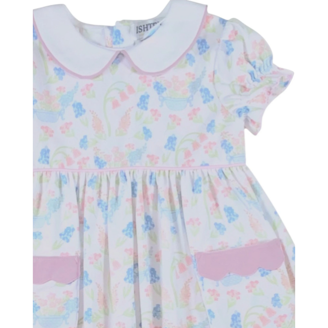 That Store primrose pink floral dress with white peter pan collar, puff sleeves, and scalloped pocket detail.