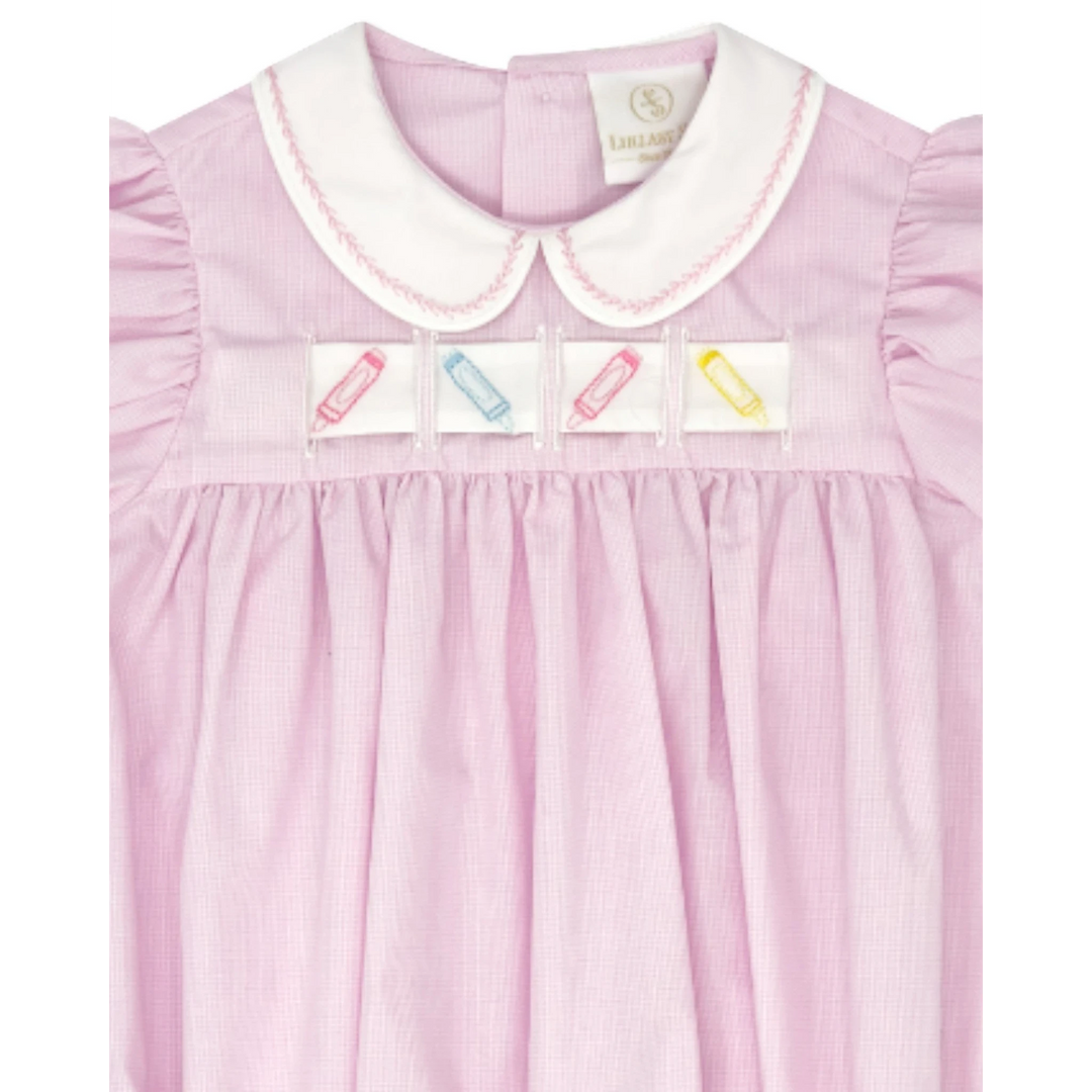 That Store pink mini gingham bubble dress with a white Peter Pan collar and interchangeable crayon ribbon detail.