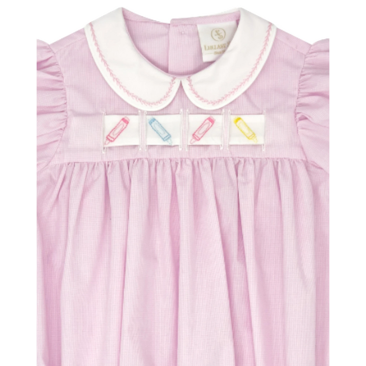 That Store pink mini gingham bubble dress with a white Peter Pan collar and interchangeable crayon ribbon detail.