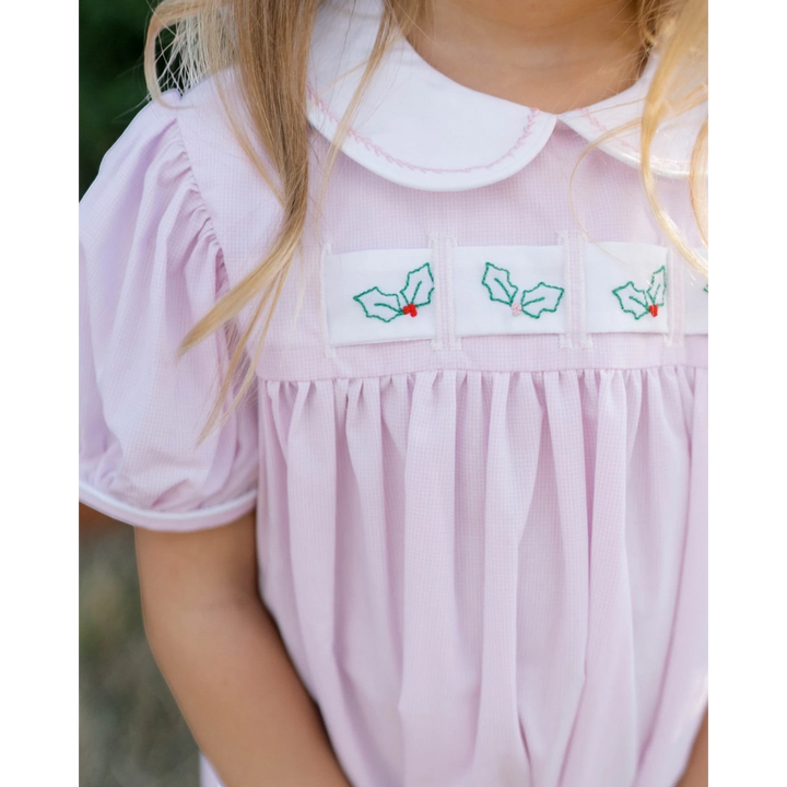 That Store pink mini gingham dress with interchangeable holly ribbon detail and a white peter pan collar