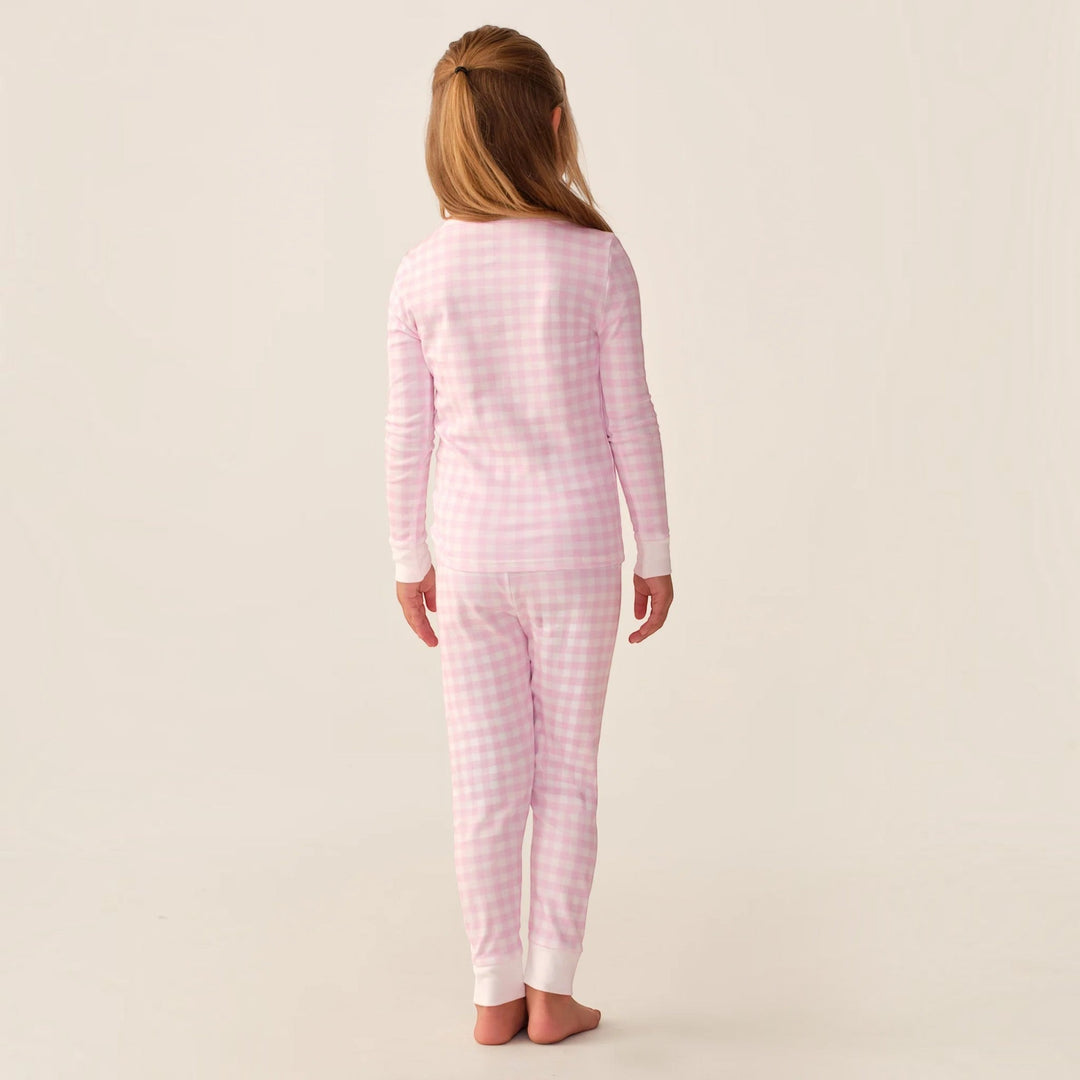 That Store pink gingham Pima cotton long sleeve pajama set worn by a young girl, back view