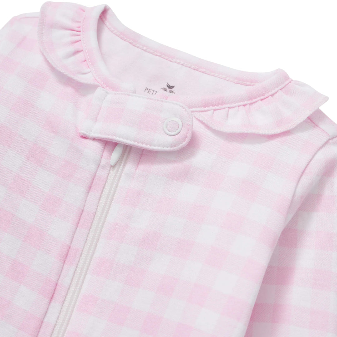 That Store pink gingham baby romper in soft Pima cotton featuring a delicate ruffle collar and front zipper closure.