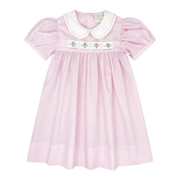 That Store pink mini gingham dress with a white Peter Pan collar and interchangeable holiday ribbon detail