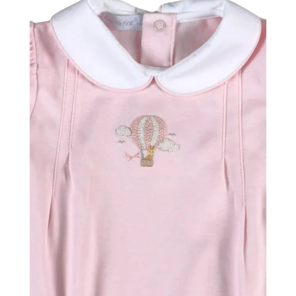 That Store pink bubble romper featuring a hand-embroidered giraffe in a hot air balloon and a white Peter Pan collar.