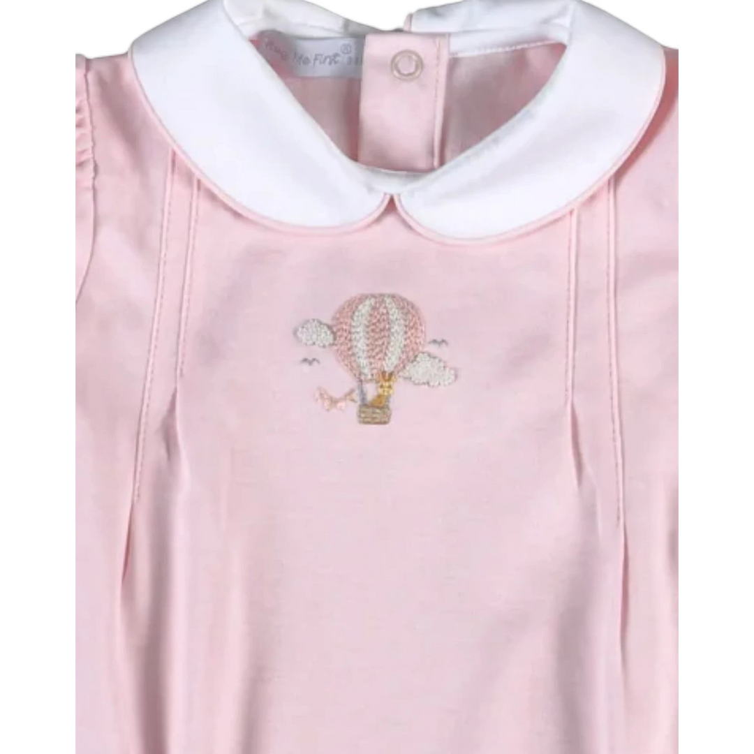 That Store pink bubble romper featuring a hand-embroidered giraffe in a hot air balloon and a white Peter Pan collar.