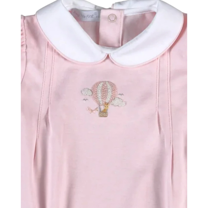 That Store pink bubble romper featuring a hand-embroidered giraffe in a hot air balloon and a white Peter Pan collar.