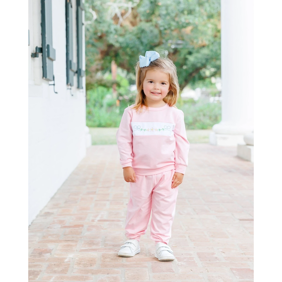 That Store pink girls jogger set featuring delicate embroidered bows and flowers on a soft, comfortable cotton fabric.