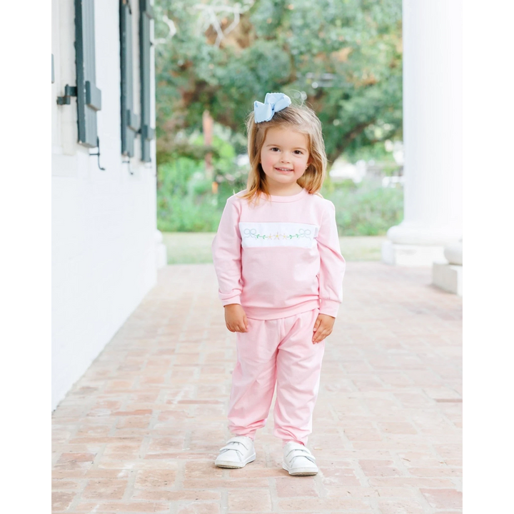 That Store pink girls jogger set featuring delicate embroidered bows and flowers on a soft, comfortable cotton fabric.