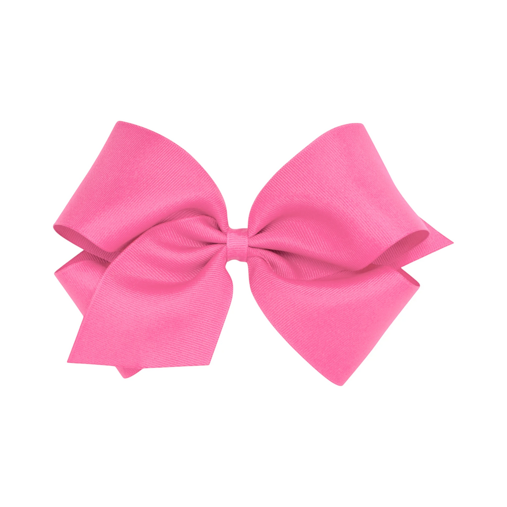 That Store bright pink grosgrain King hair bow with a secure no-slip alligator clip for toddlers and girls.