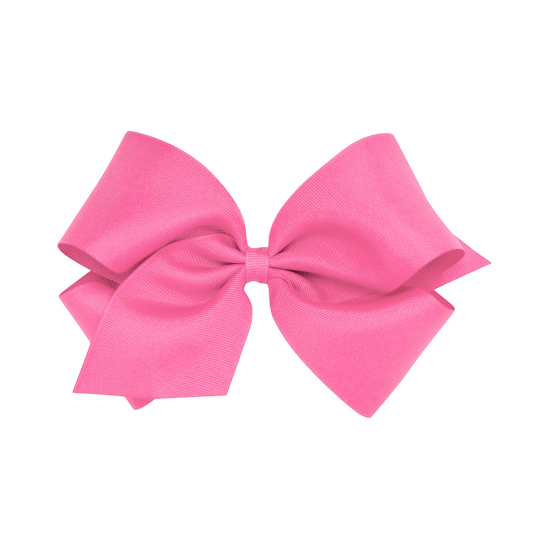 That Store bright pink grosgrain King hair bow with a secure no-slip alligator clip for toddlers and girls.