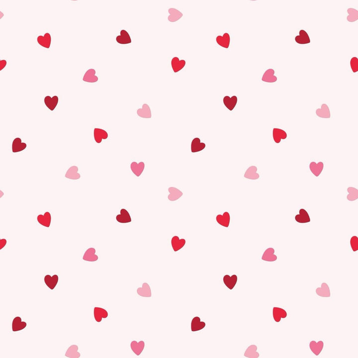 That Store Anabelle pink bloomer set fabric featuring a repeating pattern of small red and light pink heart patches.