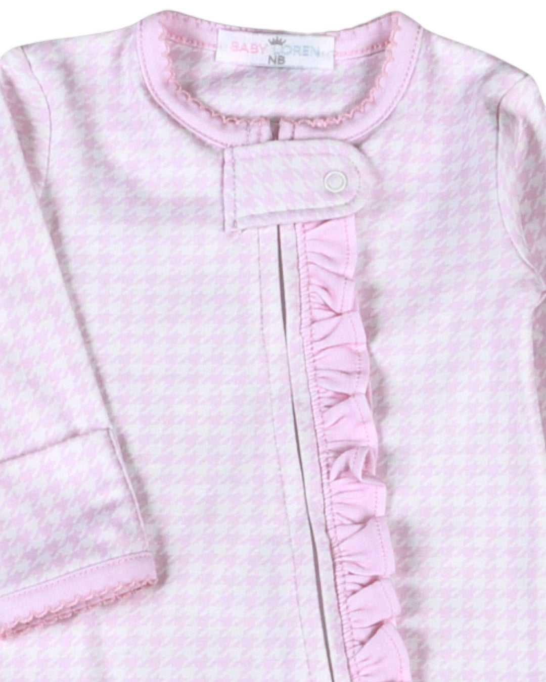 That Store pink and white houndstooth Pima cotton baby footie with a ruffled zipper front and snap closure