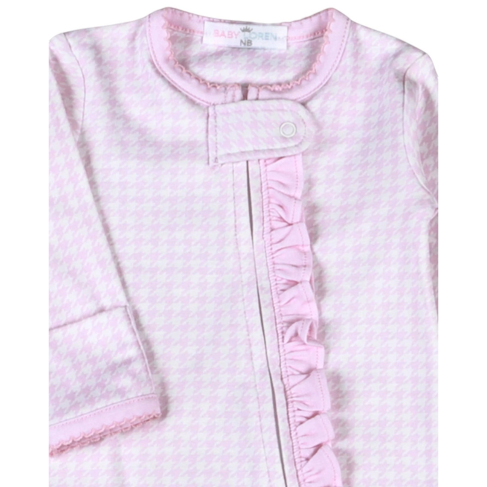 That Store pink and white houndstooth Pima cotton baby girl footie with a ruffled zipper front and snap closure.