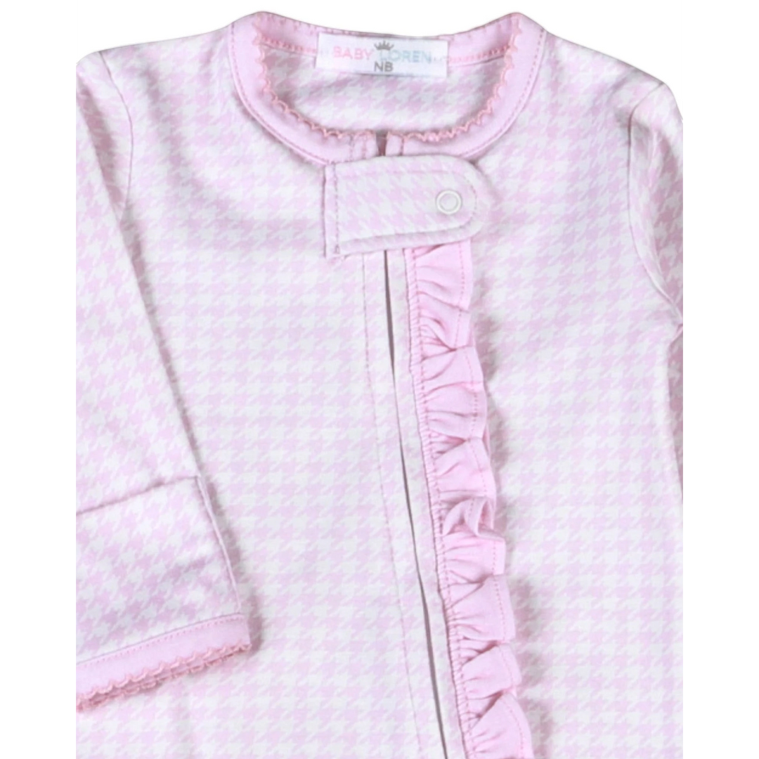 That Store pink and white houndstooth Pima cotton baby girl footie with a ruffled zipper front and snap closure.