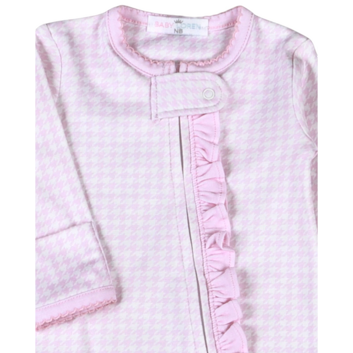 That Store pink and white houndstooth Pima cotton baby girl footie with a ruffled zipper front and snap closure.