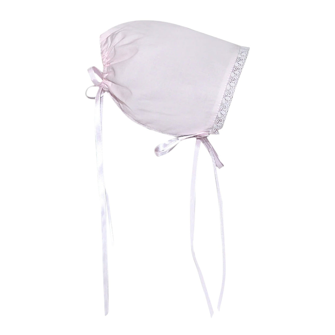 That Store blush pink baby bonnet with delicate white lace trim and ribbon ties for a vintage-inspired look