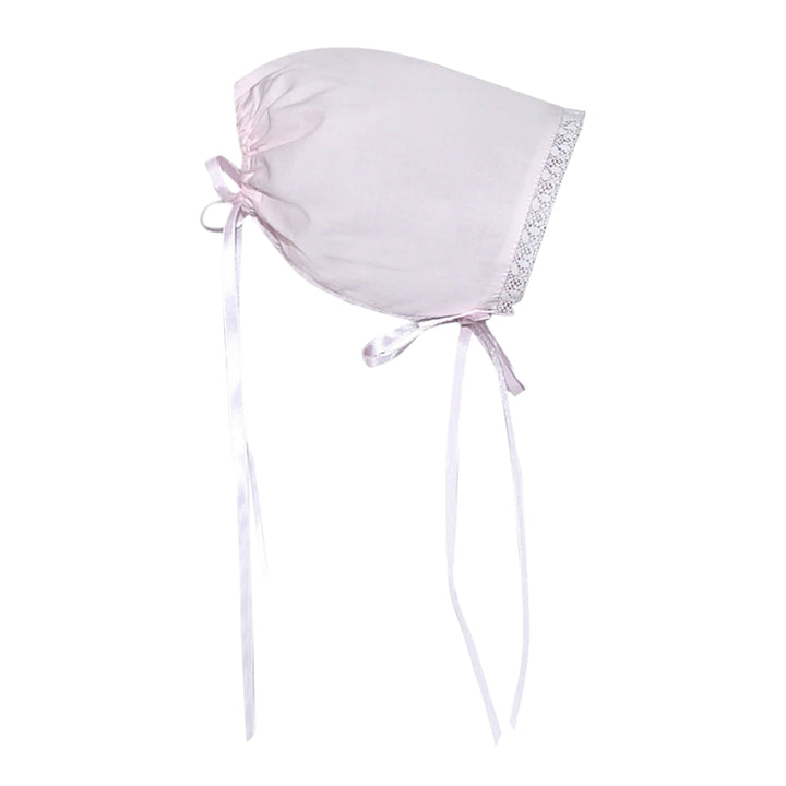 That Store blush pink baby bonnet with delicate white lace trim and ribbon ties for a vintage-inspired look