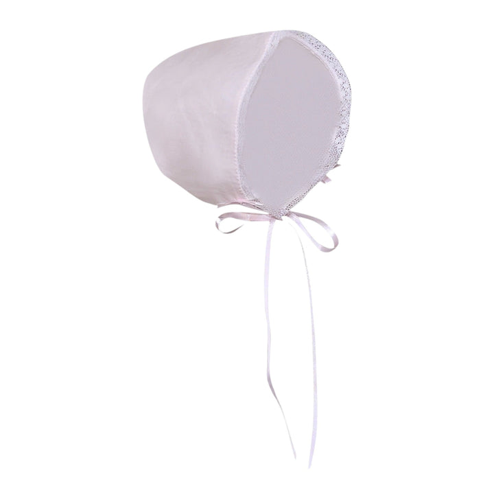 That Store blush pink baby bonnet with delicate white lace trim and ribbon ties for a vintage-inspired look