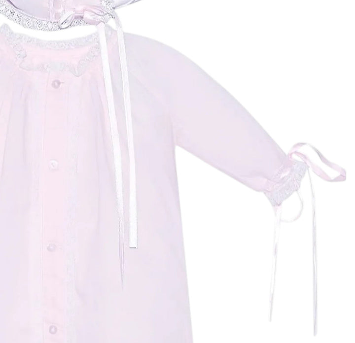 That Store pink baby daygown with ecru lace trim, button front, and matching bonnet with ribbon ties.