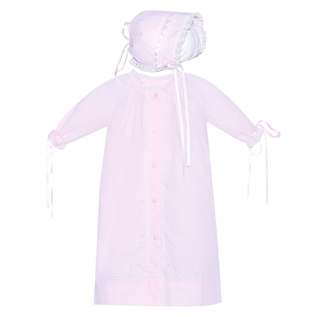 That Store pink baby daygown with matching bonnet featuring delicate ecru lace trim and ribbon cuff ties.