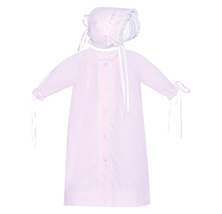 That Store pink baby daygown with matching bonnet featuring delicate ecru lace trim and ribbon cuff ties.