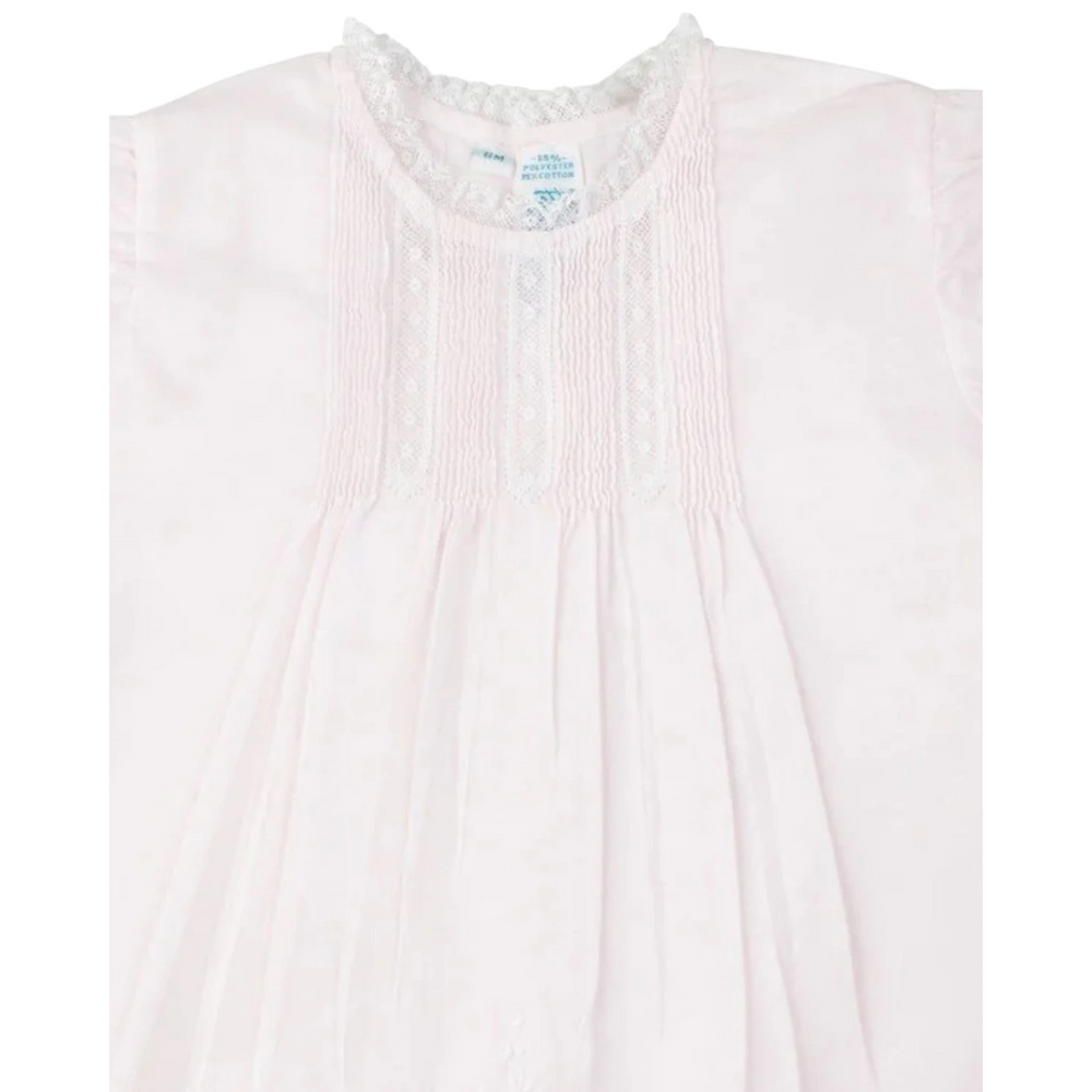 That Store vintage style pink slip dress for girls featuring delicate white lace trim, pintucks, and floral embroidery.