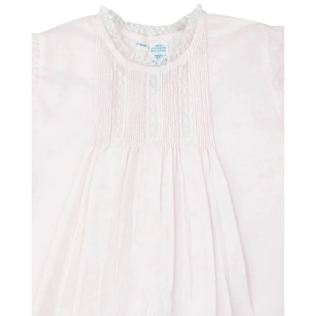 That Store vintage style pink slip dress for girls featuring delicate white lace trim, pintucks, and floral embroidery.