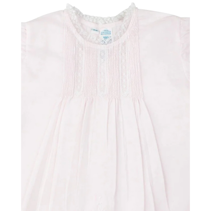 That Store vintage style pink slip dress for girls featuring delicate white lace trim, pintucks, and floral embroidery.